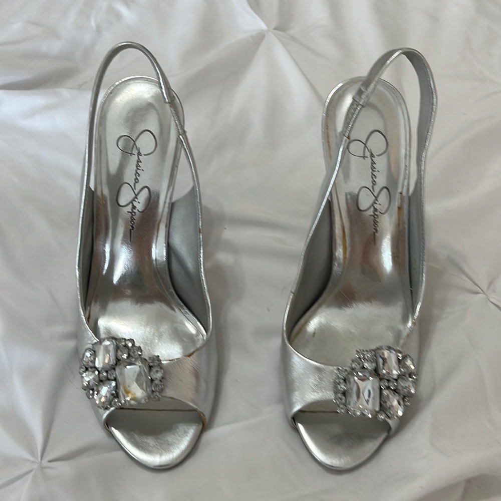Special occasion silver shoe with a brooch on the toe